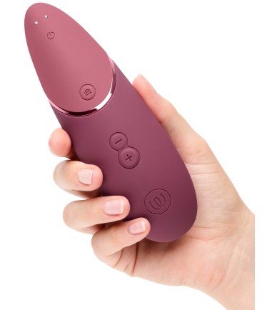 Womanizer - Next, Dusky Pink, sitter bra i handen